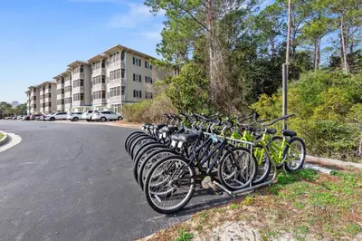 a row of bikes parked on the side of a street at Remarkably Updated 3/2 in Seagrove Highlands - Gulf Views Sleeps 9! in Santa Rosa Beach