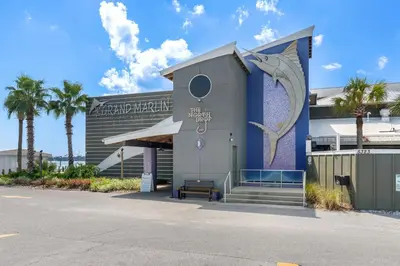 a building with a mural on the side of it at Directly On The Beach! First Floor Sundeck! Near Pier Park! Sleeps 6! in Panama City Beach
