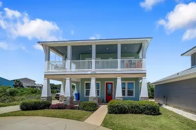 a large house with a balcony on top of it at 5 Bed, 5 Bath Beach Home/Only a 3 Minute Walk To The Beach! SLEEPS 12 in Panama City Beach