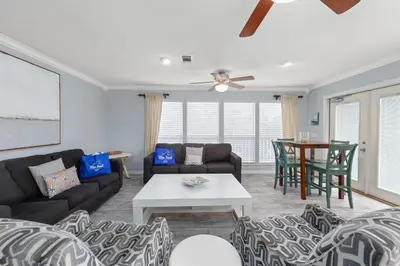 a living room with a couch and a table at One Upon A Tide - Private Pool - Mother-In-Law Suite in Santa Rosa Beach