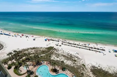 an aerial view of a beach and the ocean at Come See Why This Is The Best Condo At Grand Panama! Rooftop Pool+Tiki Bar in Panama City Beach