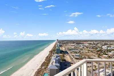 a view of the beach from the balcony of a condo at End Unit - Directly On The Gulf! Sleeps 6! Italian Luxury Furnishings! in Panama City Beach
