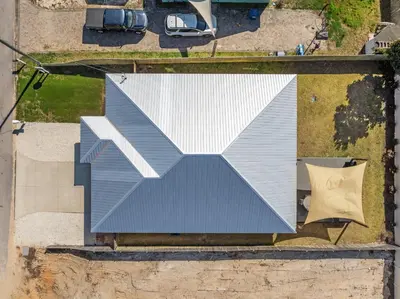 an overhead view of a house with a blue roof at Amazing New 3br/2ba Laguna Beach! / 6p GOLF CART: 2 mins to Beach/West PCB in Panama City Beach