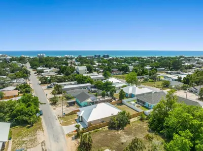 an aerial view of a small town next to the ocean at Amazing New 3br/2ba Laguna Beach! / 6p GOLF CART: 2 mins to Beach/West PCB in Panama City Beach