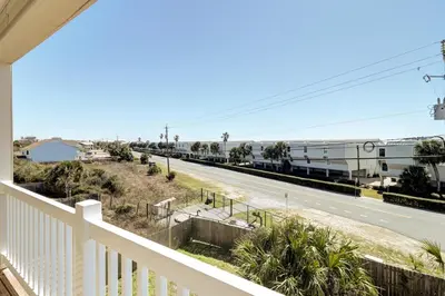 a view from the balcony of a house with a road at Summer Dayz - Families Love It Here, Just Across from the Beach in Panama City Beach