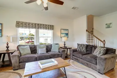 a living room with a couch and a table at Summer Dayz - Families Love It Here, Just Across from the Beach in Panama City Beach