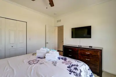 a bedroom with a bed with towels on it at Summer Dayz - Families Love It Here, Just Across from the Beach in Panama City Beach