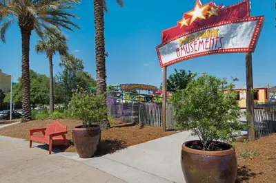 a sign for a amusement park with a roller coaster at Rooftop Views of The Gulf! 1800 Square Foot Private Rooftop Terrace! in Panama City Beach