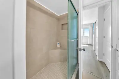 a bathroom with a shower with a glass door at Pinnacle Port C1-502 in Panama City Beach