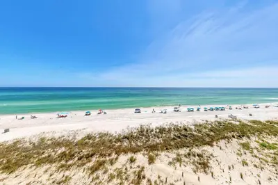 an aerial view of a beach with people and the ocean at Pinnacle Port C1-502 in Panama City Beach