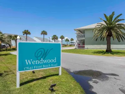 a sign in front of a house in front of a house at Wendwood #E2 in Panama City Beach