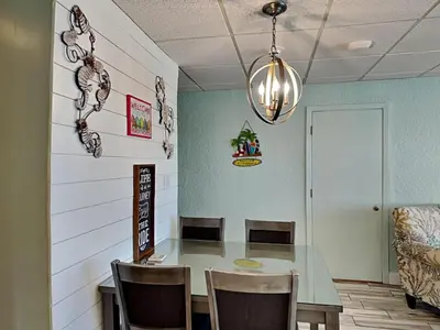 a dining room with a table and chairs at Continental 319-320 in Panama City Beach
