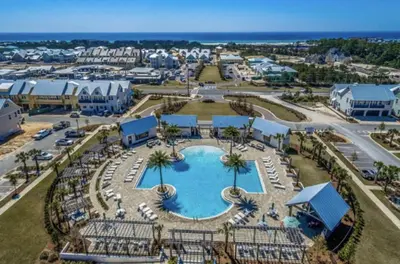 an aerial view of a pool at a resort at Current Affairs Brand New 2 BR Townhome in Prominence Golf Cart Included in Inlet Beach