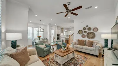 a living room with a couch and chairs and a table at Aint Nothin Wrong With Getting Your Sun Daze On in Panama City Beach