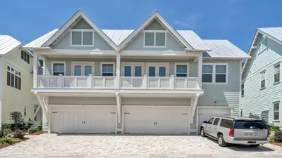 a house with a car parked in front of it at Aint Nothin Wrong With Getting Your Sun Daze On in Panama City Beach