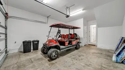 a golf cart is parked in a room at Aint Nothin Wrong With Getting Your Sun Daze On in Panama City Beach