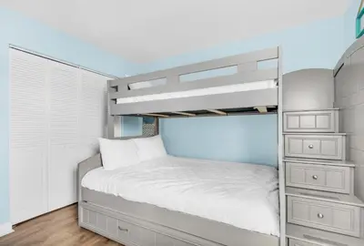 a small bedroom with a bunk bed and a drawer at Horizon South 8B2- Sunshine Gardens in Panama City Beach