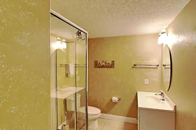a bathroom with a shower and a toilet and a sink at Palazzo #1407 in Panama City Beach
