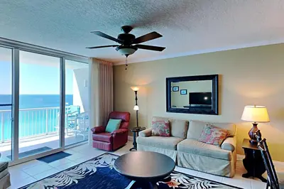 a living room with a couch and a ceiling fan at Palazzo #1407 in Panama City Beach