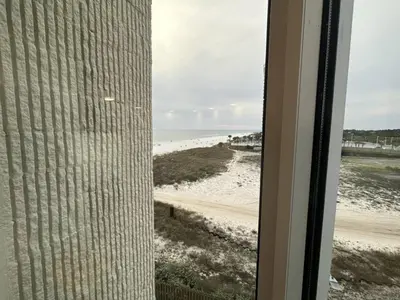 a view of the beach from the window of a building at Top of the Gulf 410 Beach Front Condo - Renovated! in Panama City Beach