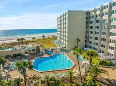 an aerial view of a resort with a swimming pool and the beach at Top of the Gulf 410 Beach Front Condo - Renovated! in Panama City Beach