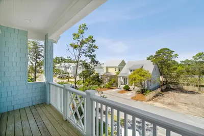 a view from the balcony of a house at 30A Beach House - Harlie's House by Panhandle Getaways in Inlet Beach