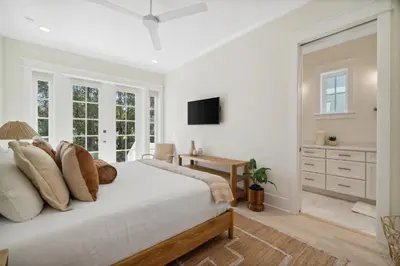 a white bedroom with a bed and a desk at 30A Beach House - Harlie's House by Panhandle Getaways in Inlet Beach