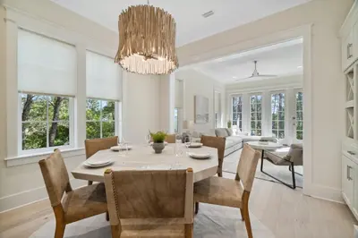 a dining room with a table and chairs at 30A Beach House - Harlie's House by Panhandle Getaways in Inlet Beach