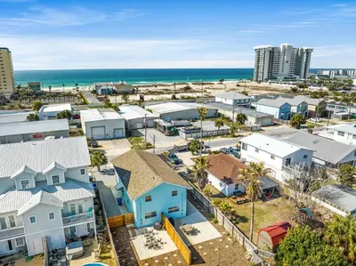 an aerial view of a city with houses and the beach at Welcome to Dolphin Fun A! BRAND NEW Duplex! Walk to the Beach! in Panama City Beach