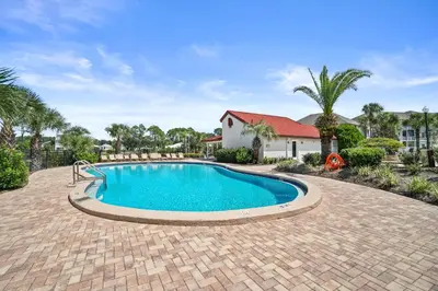 a swimming pool in the middle of a brick driveway at St Thomas Square by Panhandle Getaways in Panama City Beach