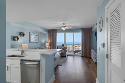 a kitchen with a view of the ocean at Calypso 3-708 in Panama City Beach