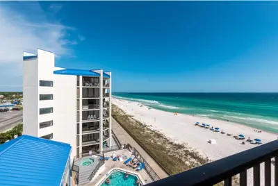a view of the beach from the balcony of a resort at AquaVista Beach Resort by Sand Seeker Vacations in Panama City Beach