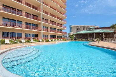a large swimming pool in front of a hotel at Hidden Dunes 1803 in Panama City Beach