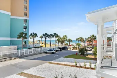 a view of the beach from the balcony of a building at Beach House with Private Pool - Elevated Escape by Panhandle Getaways in Panama City Beach