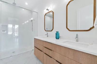 a bathroom with a sink and a mirror at Beach House with Private Pool - Elevated Escape by Panhandle Getaways in Panama City Beach