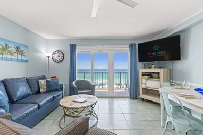 a living room with a couch and a table at The Summit 712 in Panama City Beach