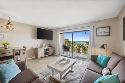 a living room with a couch and a table at The Summit 307 in Panama City Beach
