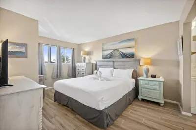 a bedroom with a large bed and a television at The Summit 307 in Panama City Beach