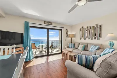 a living room with a view of the ocean at The Summit 731 in Panama City Beach