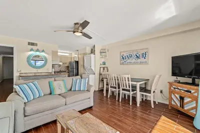 a living room with a couch and a table at The Summit 731 in Panama City Beach