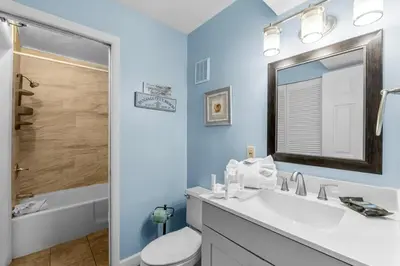 a bathroom with a sink and a toilet and a shower at The Summit 1123 in Panama City Beach