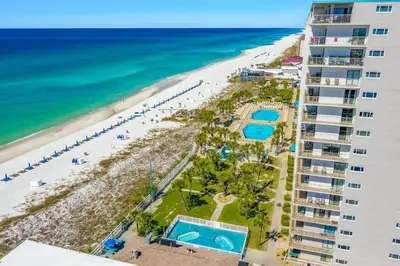 a view of the beach from the balcony of a resort at The Summit 1123 in Panama City Beach