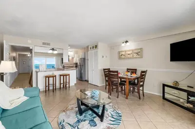 a living room with a couch and a table at The Summit 1123 in Panama City Beach