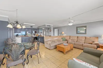 a living room with a couch and a table at The Summit 1503 in Panama City Beach