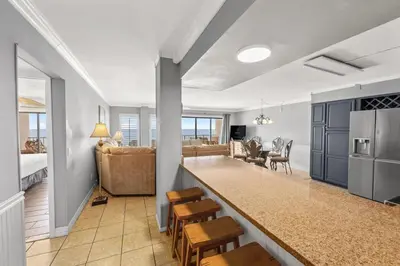 a room with a kitchen and a living room at The Summit 1503 in Panama City Beach