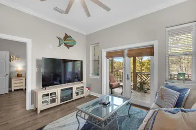 a living room with a television and a table at 30A-SEA For Yourself - Seagrove Highlands in Santa Rosa Beach