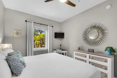 a white bedroom with a bed and a mirror at 30A-SEA For Yourself - Seagrove Highlands in Santa Rosa Beach