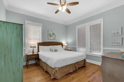 a bedroom with a bed and a ceiling fan at Bless My Sol in Santa Rosa Beach