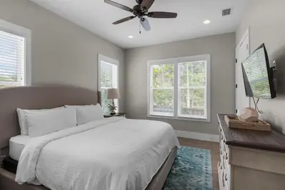 a bedroom with a bed and a ceiling fan at Lifestyles & Dreams in Santa Rosa Beach