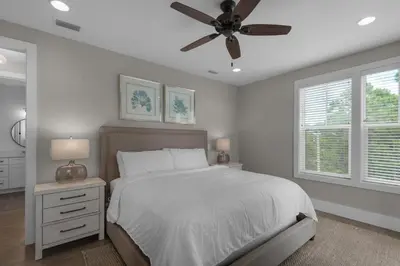 a bedroom with a bed and a ceiling fan at Lifestyles & Dreams in Santa Rosa Beach
